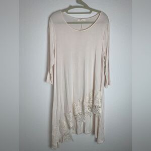 Blush Noir: Asymmetrical Hem Creme Tunic with Delicate Lace details.